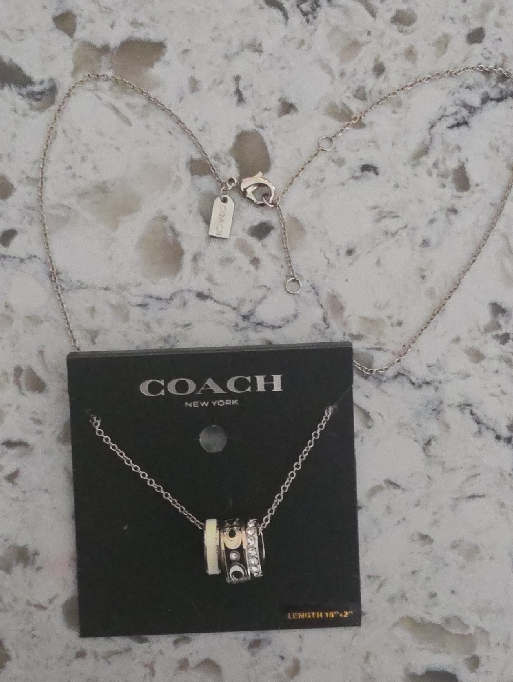 COACH Silver and Cream Ring Pendant Necklace
